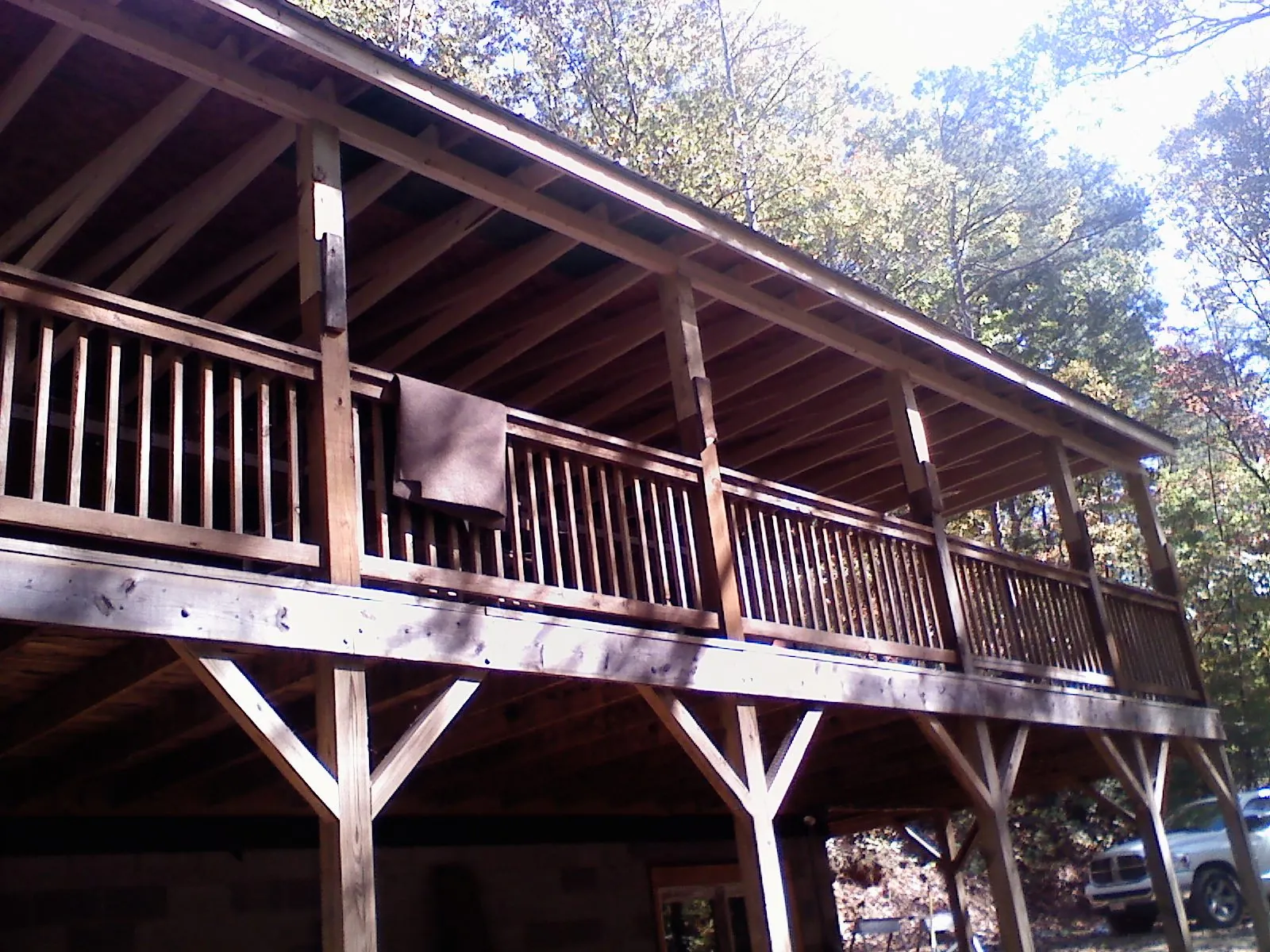 Timber framing under a new elevated porch and deck — Roof Leak Repair in Long Lake by Roofing Brothers